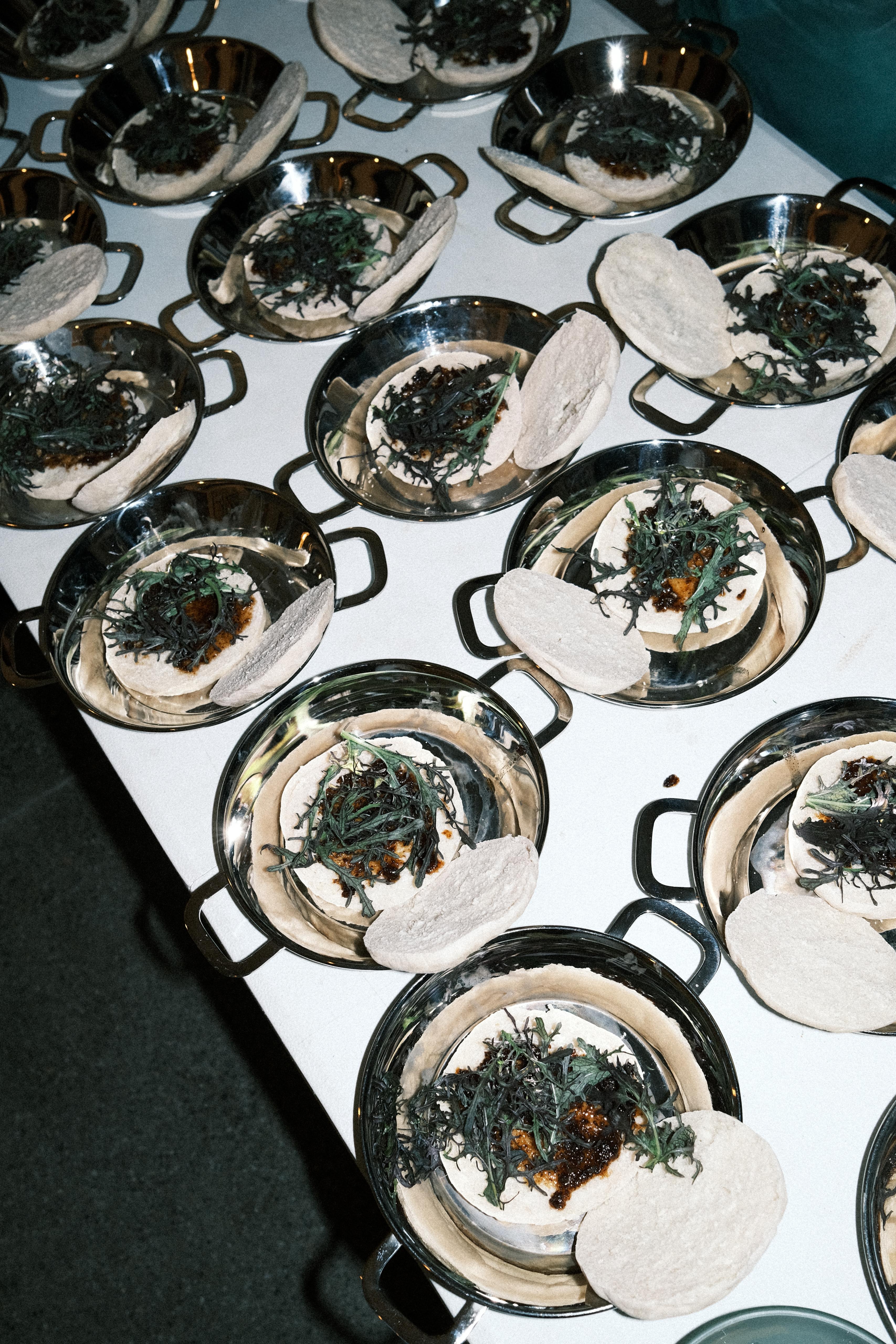 Canapés on stainless dishes from above